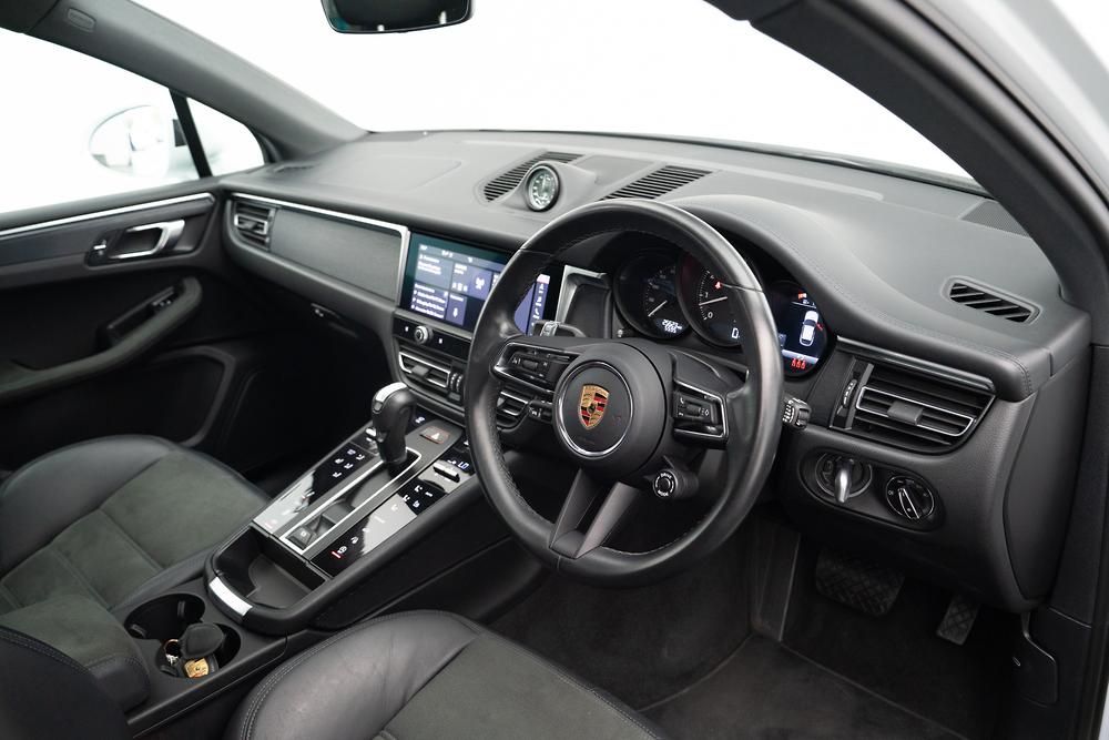 Interior of a Porsche shown from the drivers side